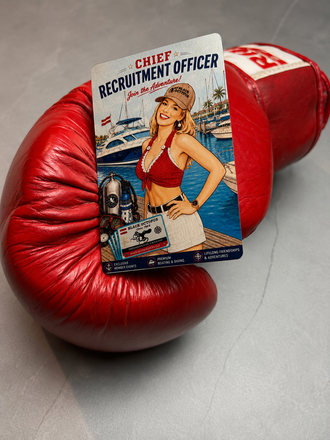 Chief Recruitment Officer — bold illustrated metal card propped against boxing gloves